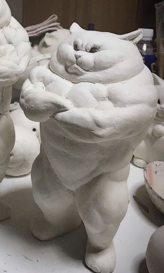 Muscular cat clay sculpture